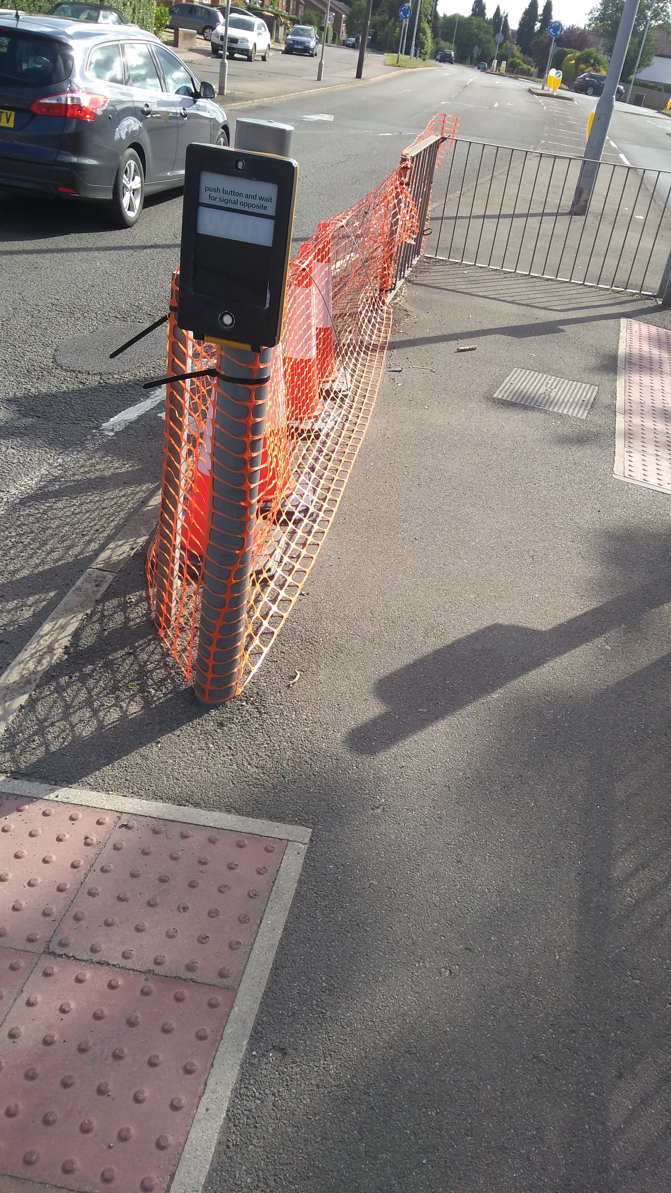 The temporary cones and tape at the junction